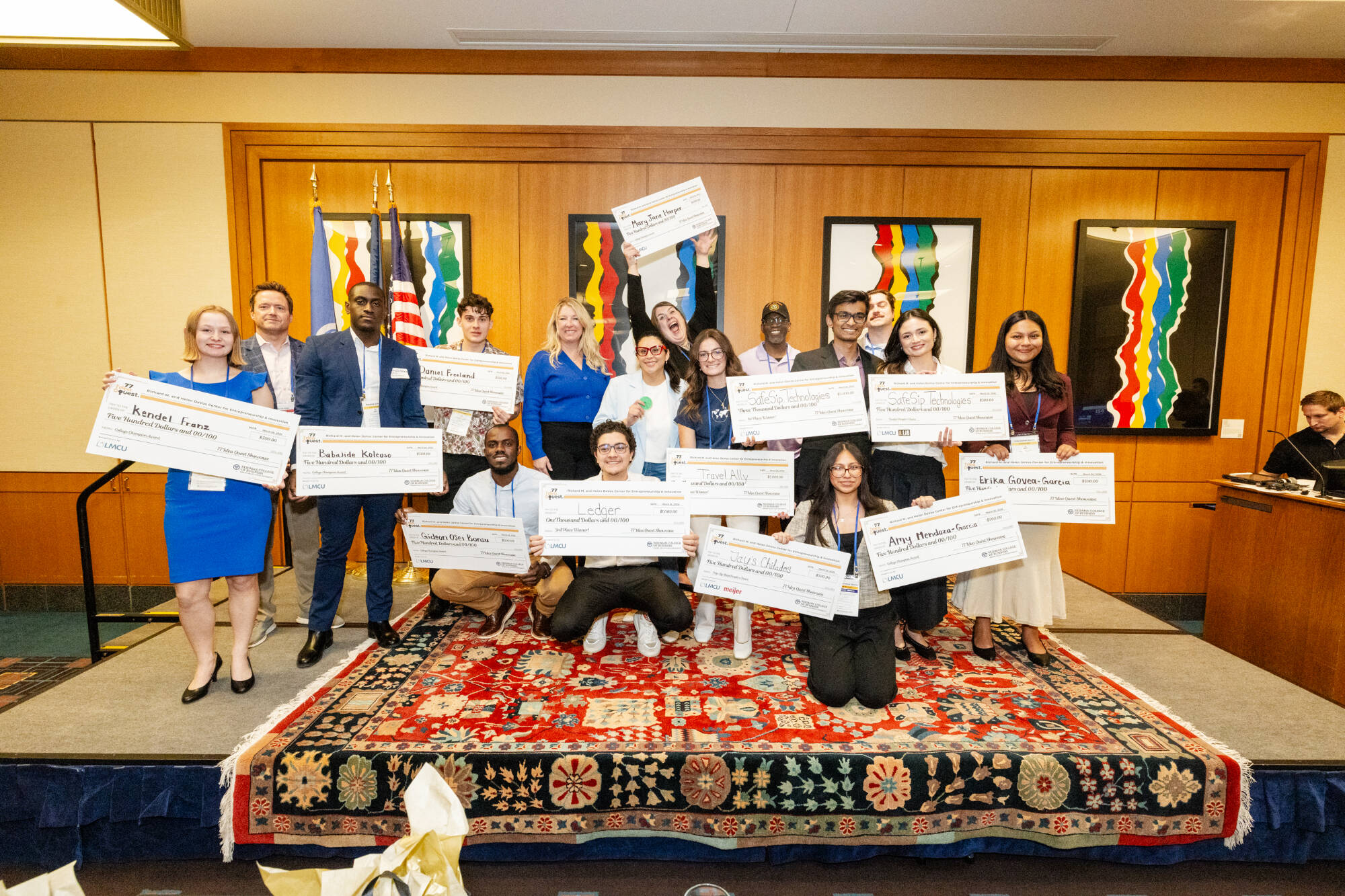 2026 77 Idea Quest winners holding checks